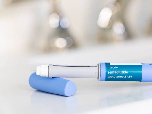 GLP-1 Semaglutide injection pen in bathroom on countertop with a white surface