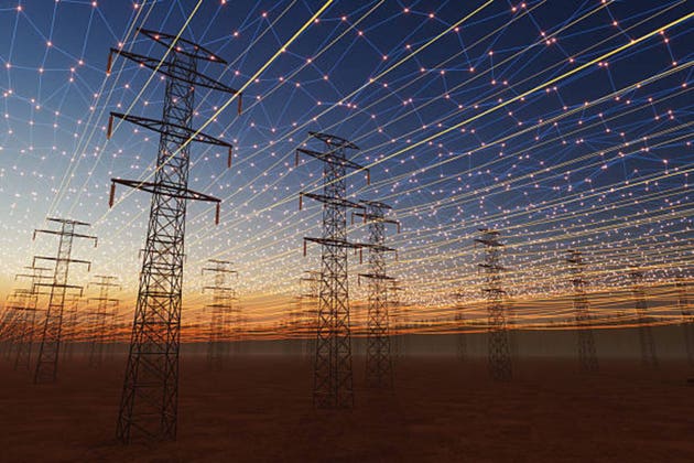 Digital Energy Grid Concept with High-Voltage Power Lines at Sunset