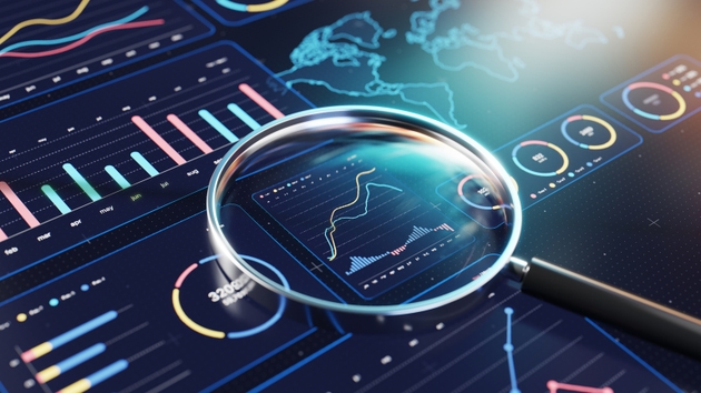 Data Analytics And Visualization With Magnifying Glass Over Digital Charts And Dashboards