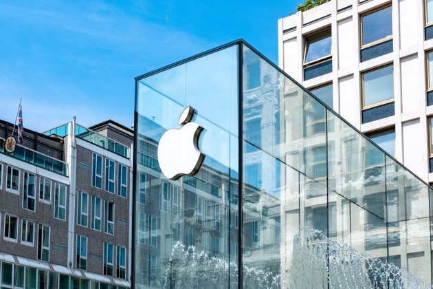 White Apple logo on glass, office window, modern tech store shop, sleek branding, iconic symbol, Milan, Italy - May 21, 2025