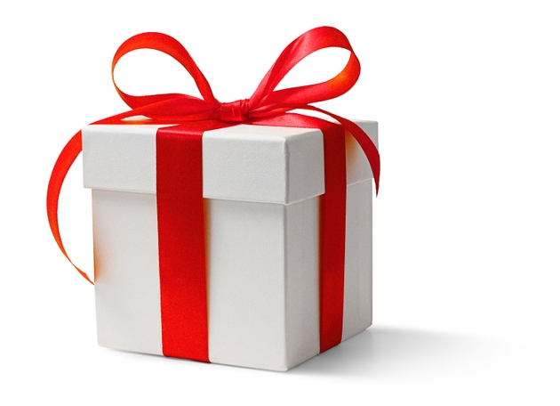 White gift box with red bow on a white background