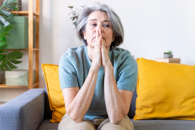 Senior woman feeling stressed and worried at home