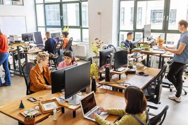 Diverse professionals working in a modern open-plan office