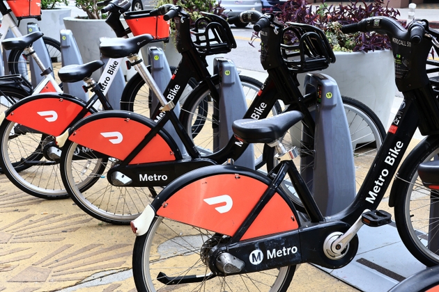 Los Angeles California: Metro Bike bicycles with DoorDash advertising at a public bike sharing station