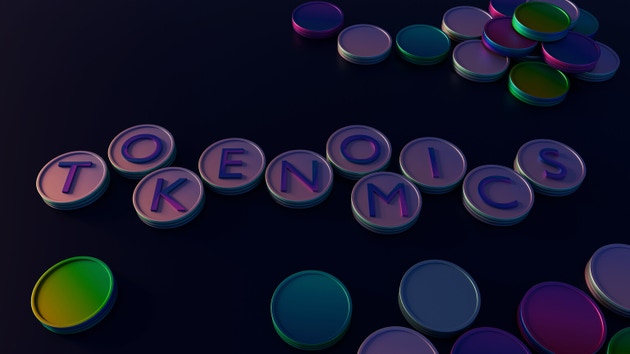 La parola "TOKENOMICS" in cappucci luminosi su una griglia di monete circolari stilizzate.