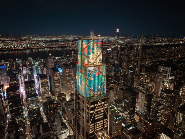 Lateral Night aerial view of 270 Park Avenue JPMorgan Chase headquarters with illuminated Midtown Manhattan skyline