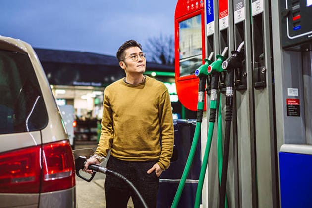 Man refuelling car at petrol station