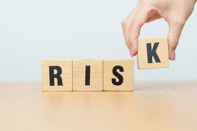 wooden block Risk. High Risk High Return, strategy, analysis, marketing, risk management, wealth, opportunity and Crisis concepts