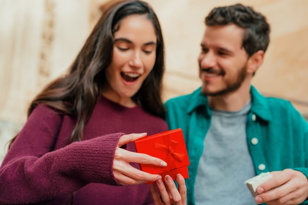 Happy Woman Reacting to Surprise Gift from Partner