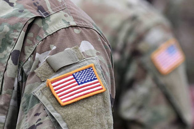 US soldiers. US army. USA patch flag on the US military uniform. United States Armed Forces. Veterans Day.