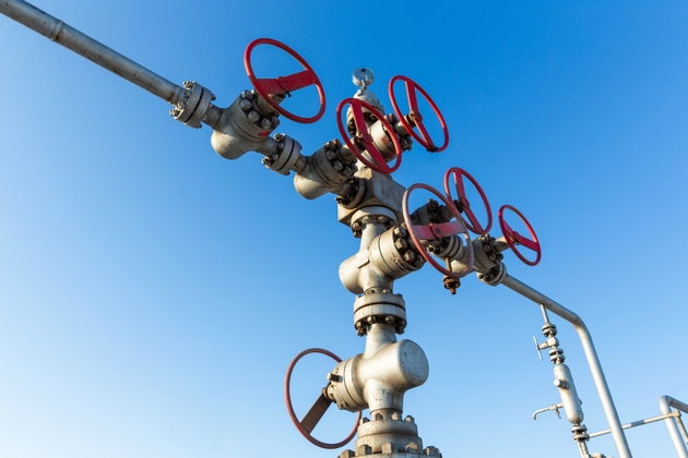 Close up shot of well head of a natural gas field station.