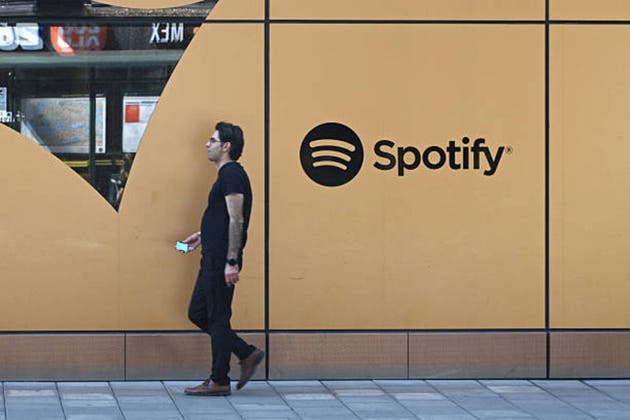 A man walks by the Spotify HQ in Stockholm