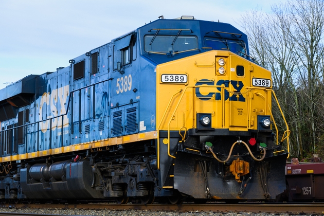 CSX blue and yellow freight train locomotive in closeup with brand logo