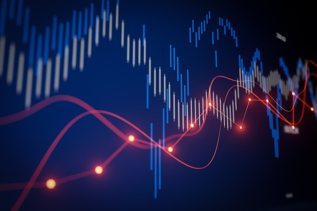 Visual display of stock market trends with blue and red lines showing data fluctuations and trading activity