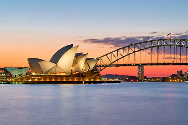 Sydney Opera House and Harbour Bridge at sunset.