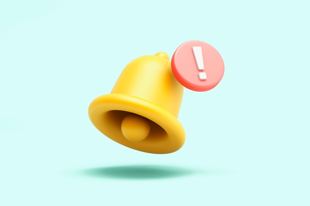 Notification bell with warning symbol