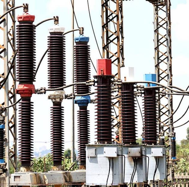 High voltage ceramic insulators and power cables in electrical substation