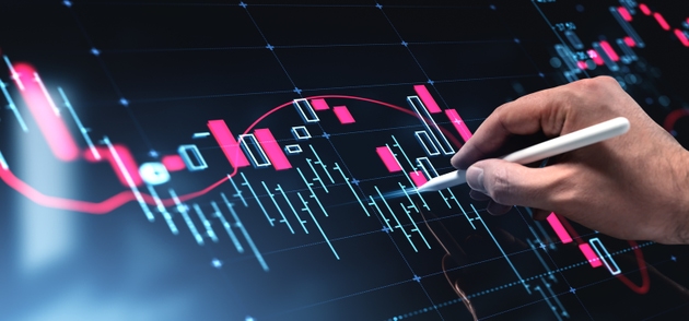 Hand analyzing digital financial chart with stylus on futuristic interface displaying red and blue candlestick patterns on dark background concept.