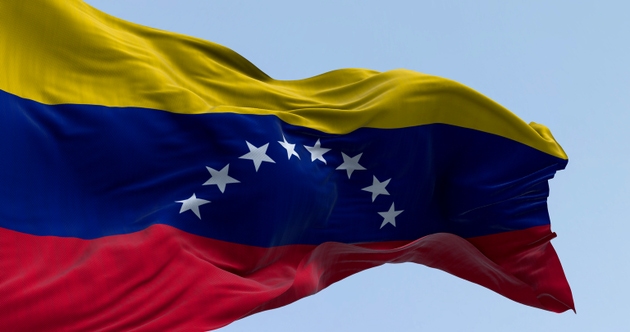 Close-up of Venezuela national flag waving on a clear day