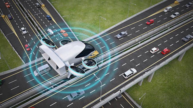 Futuristic e-VTOL flying over busy highway monitoring the urban traffic