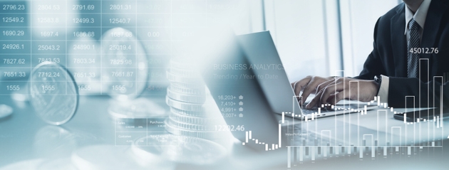 Business, finance, banking and investment concept. Finance analyst analyzing and calculating financial data with economic graph growth chart, Business strategy and planning for investment and asset allocation
