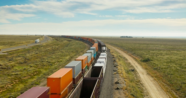 Aerial Photograph of Freight Train and Highway Crossing Eastern New Mexico Plains