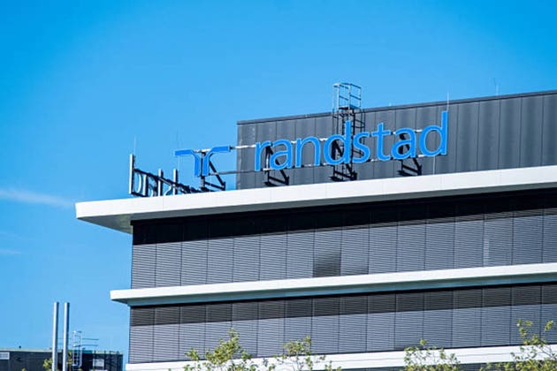Randstad logo modern office building, Dutch HR agency, staffing solutions, temporary work, trust uncertainty recruitment, corporate workforce mobility post-pandemic Europe and Asia, Eschborn, GERMANY