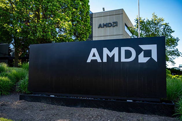 View of AMD sign in front of office building.