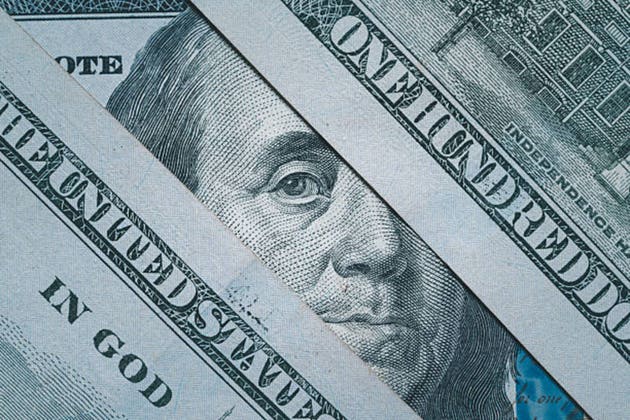 Close up of United States dollar banknotes featuring detailed currency design, symbolizing finance, investment, banking, wealth, savings, cash flow, economic growth, and global business markets.