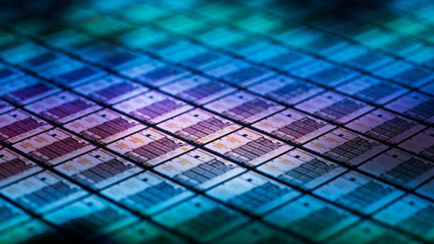 3D Render: Close-up of a Colorful Semiconductor Wafer and Silicon Dies. Computer Chip Fabrication. Semiconductor Packaging Process.