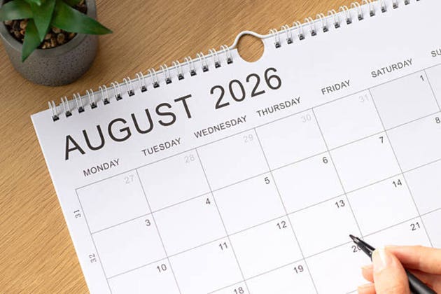 August 2026 calendar month on a wooden background