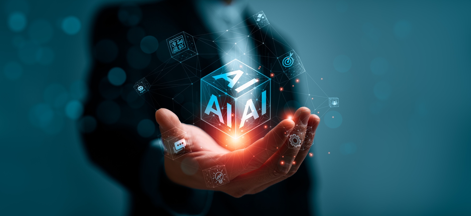Artificial intelligence business transformation concept with professional hand holding glowing AI cube interface showing automation analytics target chatbot and digital innovation network