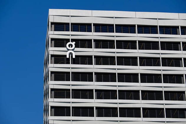 On Running company logo on modern corporate headquarters building in Zurich