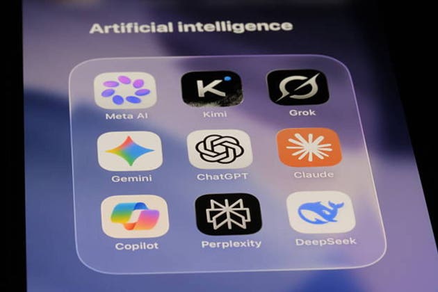 Artificial intelligence apps on phone screen. ChatGPT, Gemini, Meta AI, Copilot, Perplexity, Claude, Grok, DeepSeek, Kimi.