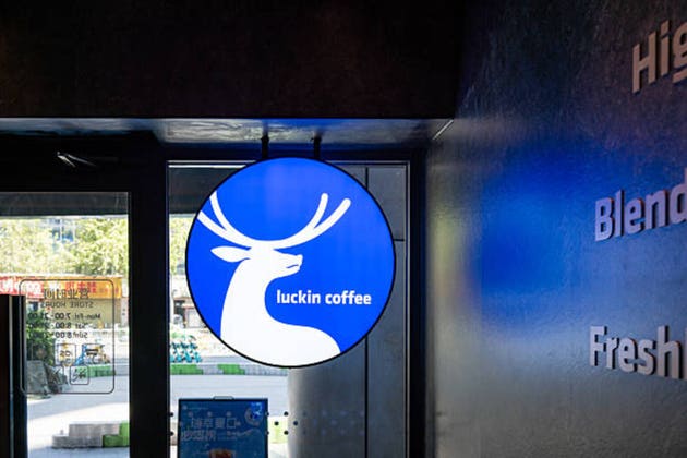 Luckin Coffee storefront showing the brand signage hanging above the main entrance.