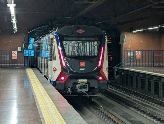 New driverless Metro Line 6 train undergoing clearance tests at Lucero station in Madrid, Spain, at night