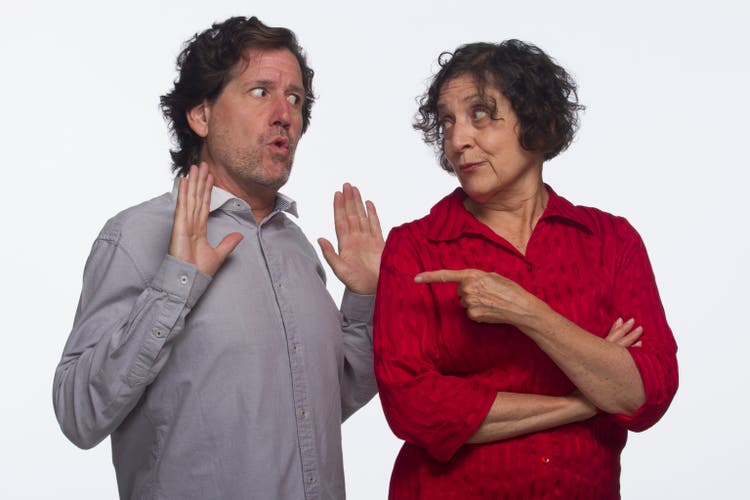 Woman pointing at man, horizontal