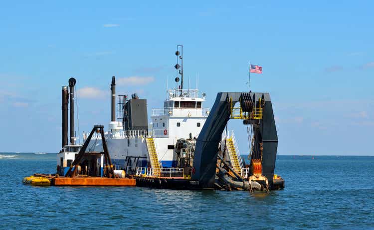 Dredger at ocean inlet