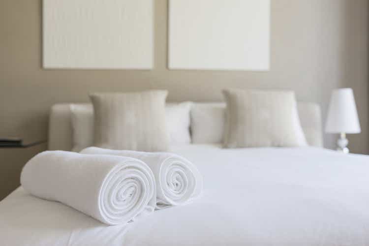Towels on bed in bedroom