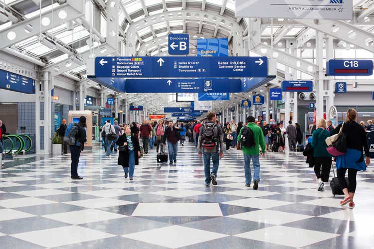 Passengers walking through Chicago O"Hare International Airport
