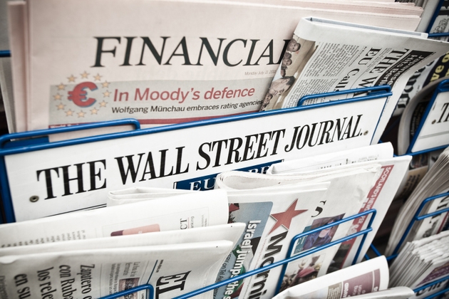 Financial Newspapers on a Newsstand