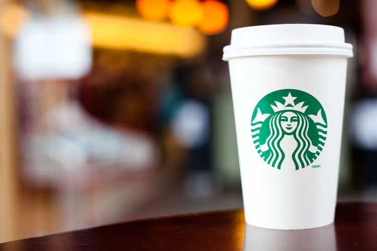 Grande Starbucks to go cup on table