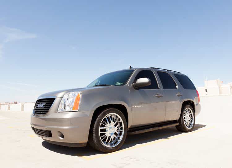 Silver GMC Denali SUV.