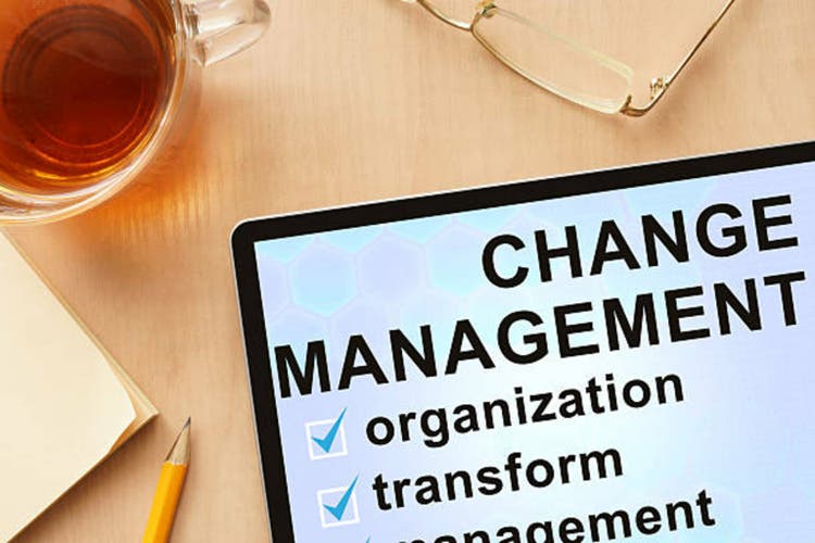Tablet with words change management.