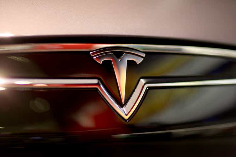 Tesla earns $46 million in the fourth quarter as shares surge amid Apple rumors