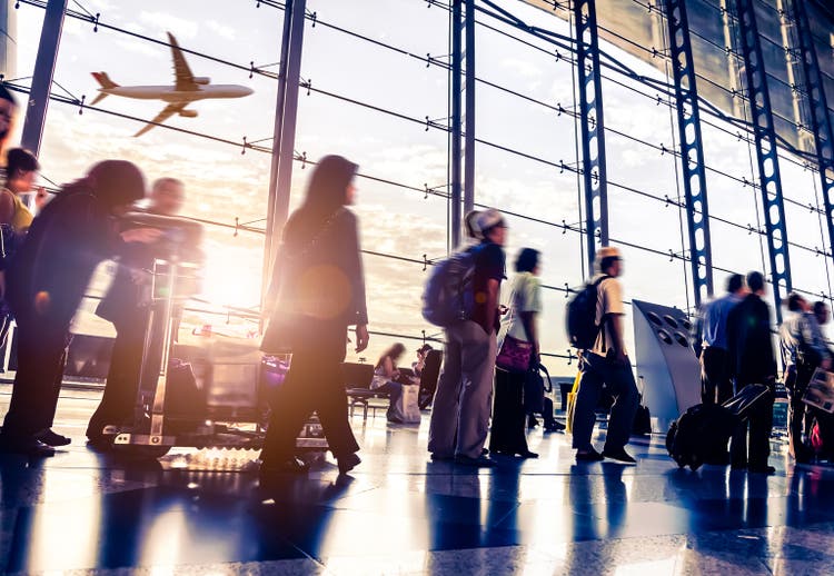 Blurred shot of people walking through Malaysia airport