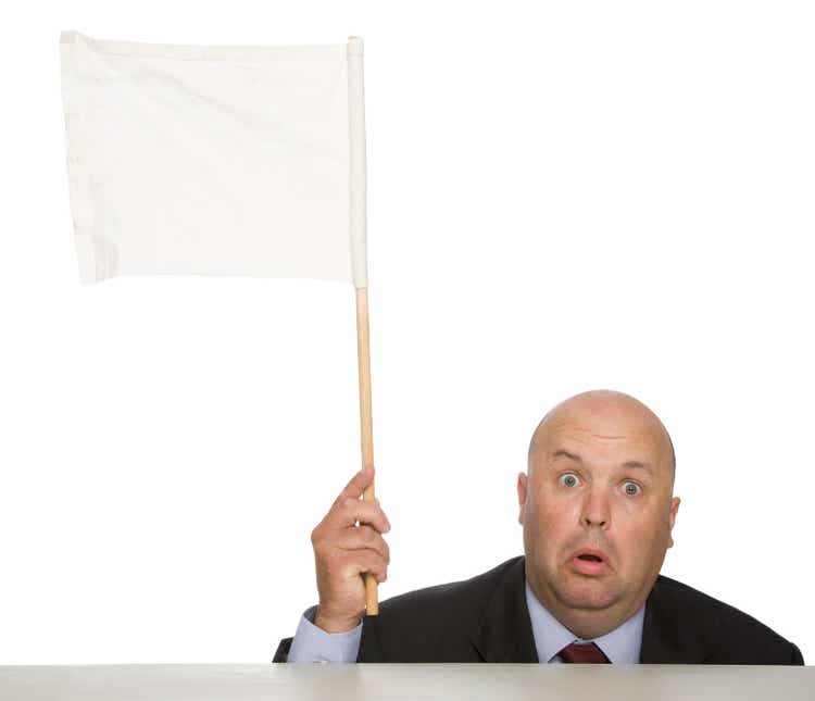 Waving a white flag to show a man defeated