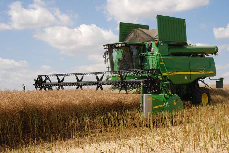 Harvest - combine at canola field