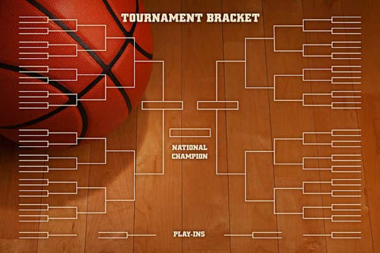 Basketball tournament bracket with spot lighting on wood gym floor