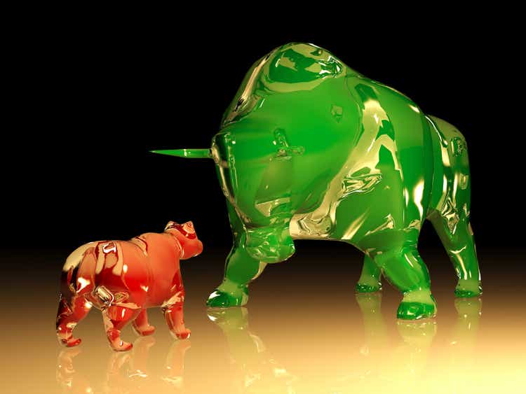 Huge green glass bull confronts red glass bear